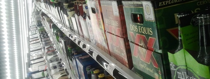 Image inside a refrigerated beer shelving row